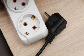 electrical extension cord with socket on table