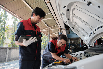 EV car check, mechanic workers coworker inspects and maintains service of electric engine and...