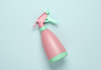 Blue-pink plastic spray bottle on a pastel background. Top view. Minimalism