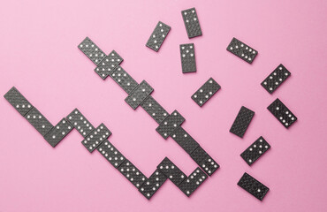 Many Dominoes on a pink background.