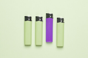 Lighters on a green background. Minimalism.