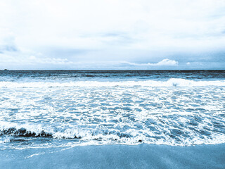 Blue ocean waves on the beach