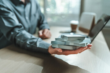 Accountant, Businessman holds dollar bill in his hand. Save money, Deposit and Banking concept.