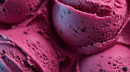 Close-up view of swirls of vibrant pink ice cream with dark chocolate chips