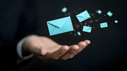 Hand Reaching for Floating Light Blue Envelopes with Sparkles