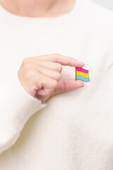 Pansexual Visibility Day and Panromantic May Awareness Day and LGBT pride month concept. hand holding pink, yellow and blue heart shape for Lesbian, Gay, Bisexual, Transgender and Marriage Equality
