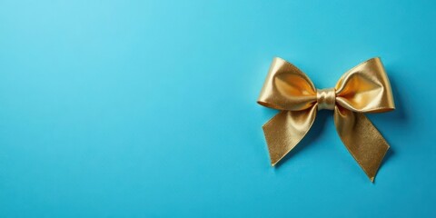 A Golden Bow on a Vibrant Blue Background, Perfect for Festive Designs and Elegant Presentations