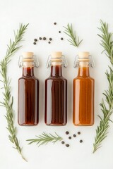 Three glass bottles filled with homemade BBQ sauces are surrounded by aromatic herbs and spices, perfect for enhancing summer grilling and outdoor cookouts