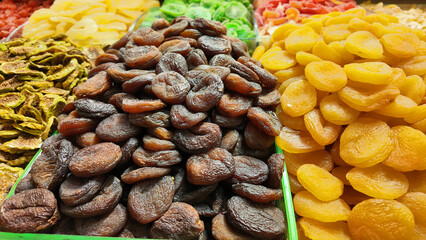 Dried fruits displayed at a market stall in vibrant colors