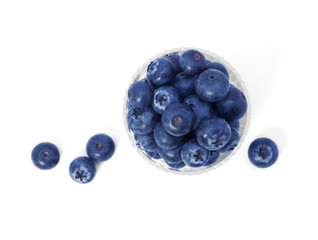 Blueberries in clear bowl isolated on white background
