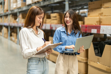 Female engineers team discussing inventory in warehouse logistics and supply chain planning,...