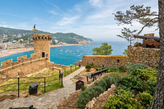 The Murallas de Tossa de Mar fortress above the beach and town on the Costa Brava coastline of Southern Spain.