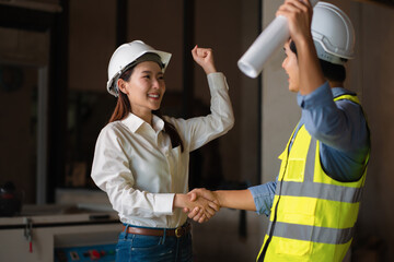 engineers worker and contractor. Client shaking hands with team builder in renovation site