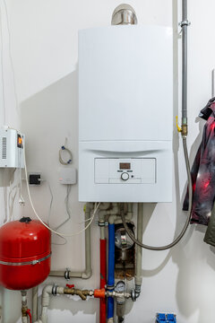 Wall-mounted gas boiler in a private house