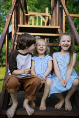 Children walk in the summer in nature. Child on a sunny spring morning in the park. Traveling with children.