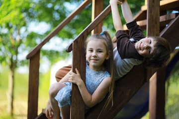 Obraz premium Children walk in the summer in nature. Child on a sunny spring morning in the park. Traveling with children.