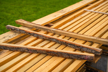 Wooden construction boards stacked close-up