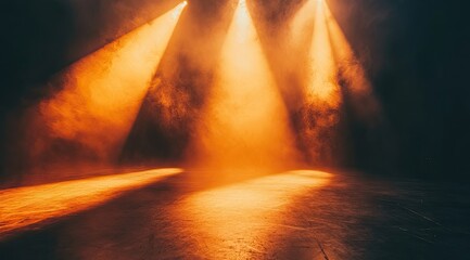 Dramatic stage lighting, amber spotlights on dark floor