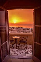Fototapeta premium View of the sunrise from hotel balcony, Santorini, Greece