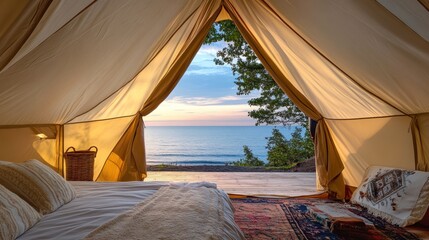Fototapeta premium Sunrise view from a luxurious glamping tent on a beach.