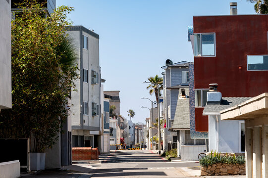 Beach alley showing backsides of beachfront homes - Powered by Adobe