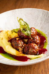 Savoring tender swedish meatballs resting on fluffy mashed potatoes, drizzled with rich sauce