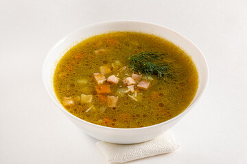 Warm and inviting bowl filled with hearty soup, featuring diced vegetables and fresh herbs