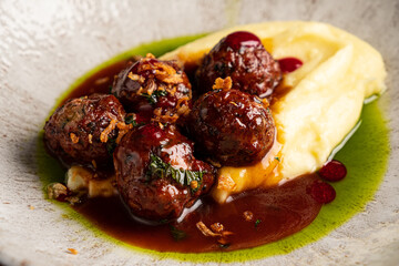 Savory Swedish meatballs with buttery mashed potatoes and a flavorful sauce await!