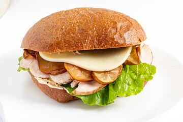 A delicious sandwich with tender turkey, sweet apples, and fresh lettuce on artisan bread