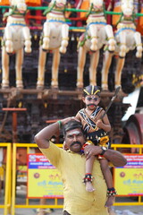 father and son. In India, a temple festival