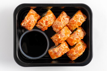 Tasty sushi rolls with fresh ingredients and soy sauce, perfect for sharing or solo enjoyment