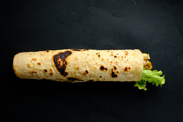 Savor a warm, flavorful wrap packed with crisp lettuce and tasty fillings, ideal for lunch