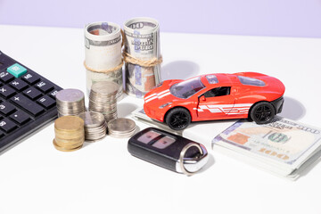A visual representation of car ownership preparation—featuring a miniature car, scattered cash,...