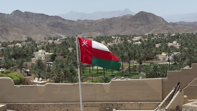 Bahla Fort in Oman with waving national flag