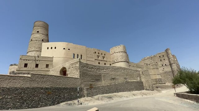 Bahla Fort in Oman with waving national flag