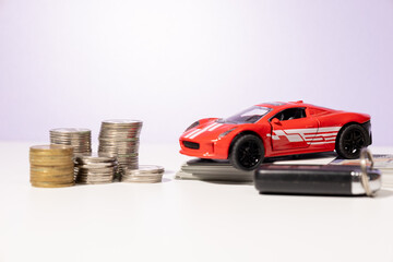 A visual representation of car ownership preparation—featuring a miniature car, scattered cash,...
