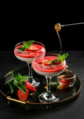Panna cotta with strawberries and mint