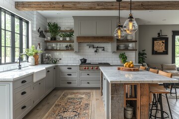 Classic kitchen with light grey cabinets, white marble countertops, natural wood accented island, pendant lighting, wooden floor, and runner rug