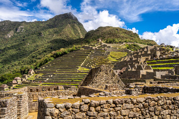 Panoramic view of Machu Picchu ruins with Huayna Picchu in background, Peru