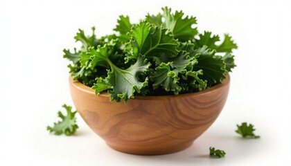 Fototapeta premium Freshly harvested kale leaves are displayed in a wooden bowl against a clean white background.