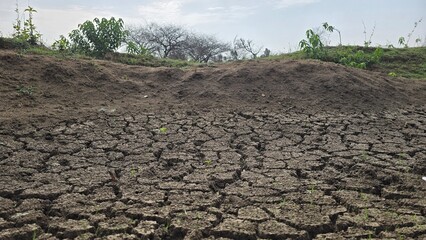 Land dried up and cracked due to drought and shortage of rain