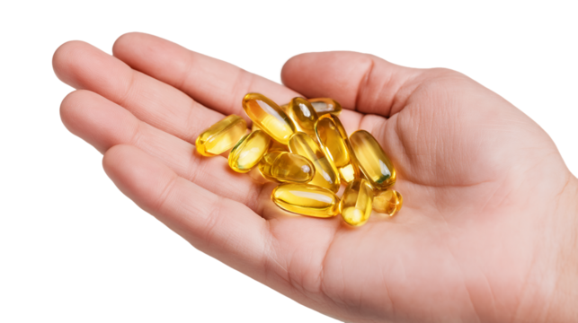 Hand Holding Golden Yellow Oval Capsules on Transparent Background, PNG