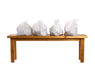 Trash bags on a bench in a clean indoor area on a transparent background, cut out