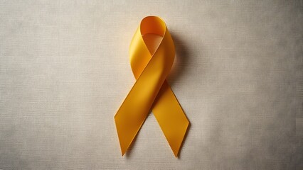 Gold Awareness Ribbon on Beige Fabric Background