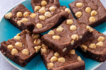 Homemade chocolate brownie photography . Top view on rustic background.Rich chocolate brownie , showcasing its dense texture and glossy surface, professional food photography.
