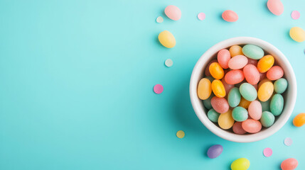Obraz premium Colorful Easter Candy in White Bowl on Blue Background with Sprinkles and Confetti Decoration
