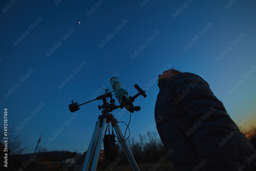 Canvas Prints amateur astronomer using telescope for watching stars, moon, planets and other celestial objects fro
