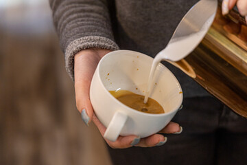 Barista coffee service concept.Barista women using coffee machine to make coffee in cafe