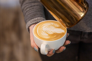Barista coffee service concept.Barista women using coffee machine to make coffee in cafe