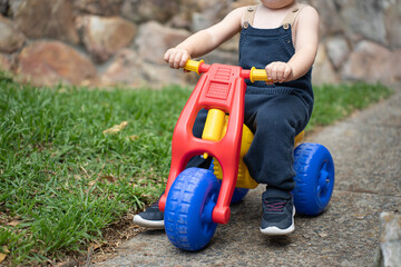 child playing childhood child on a car child with toys happy child photo of a child without a face